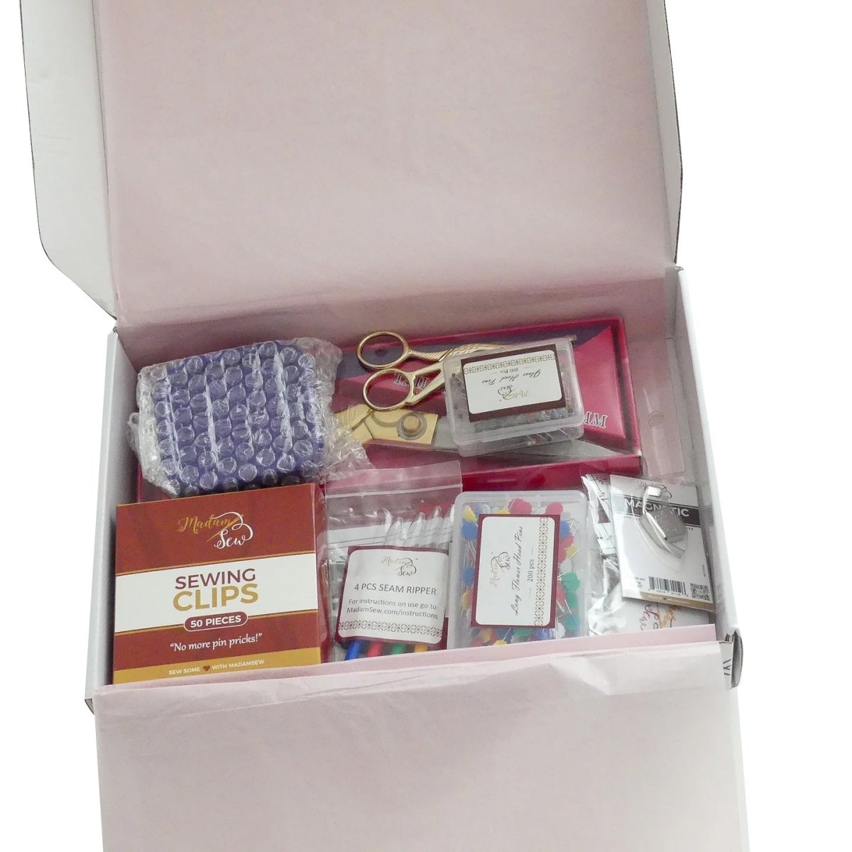 An open box showing the contents of the start with sewing essentials box