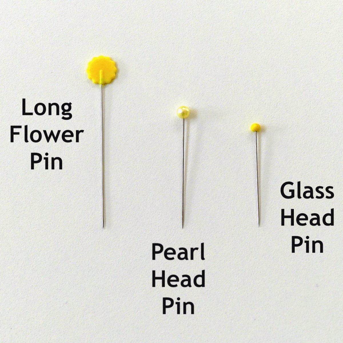Glass Head Pin next to two other types of pins to show it's size in reference to them.