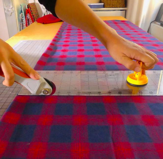 yellow ruler grip on a ruler when cutting quilt fabric