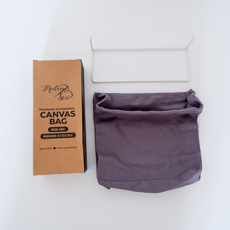 Canvas grey bag for a peg board with the cardboard packaging