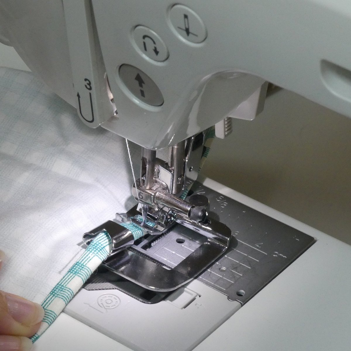 Sewing a hem with a Hemming presser foot on a sewing machine