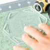 Rotary cutting around a hexagon template with rotary cutter