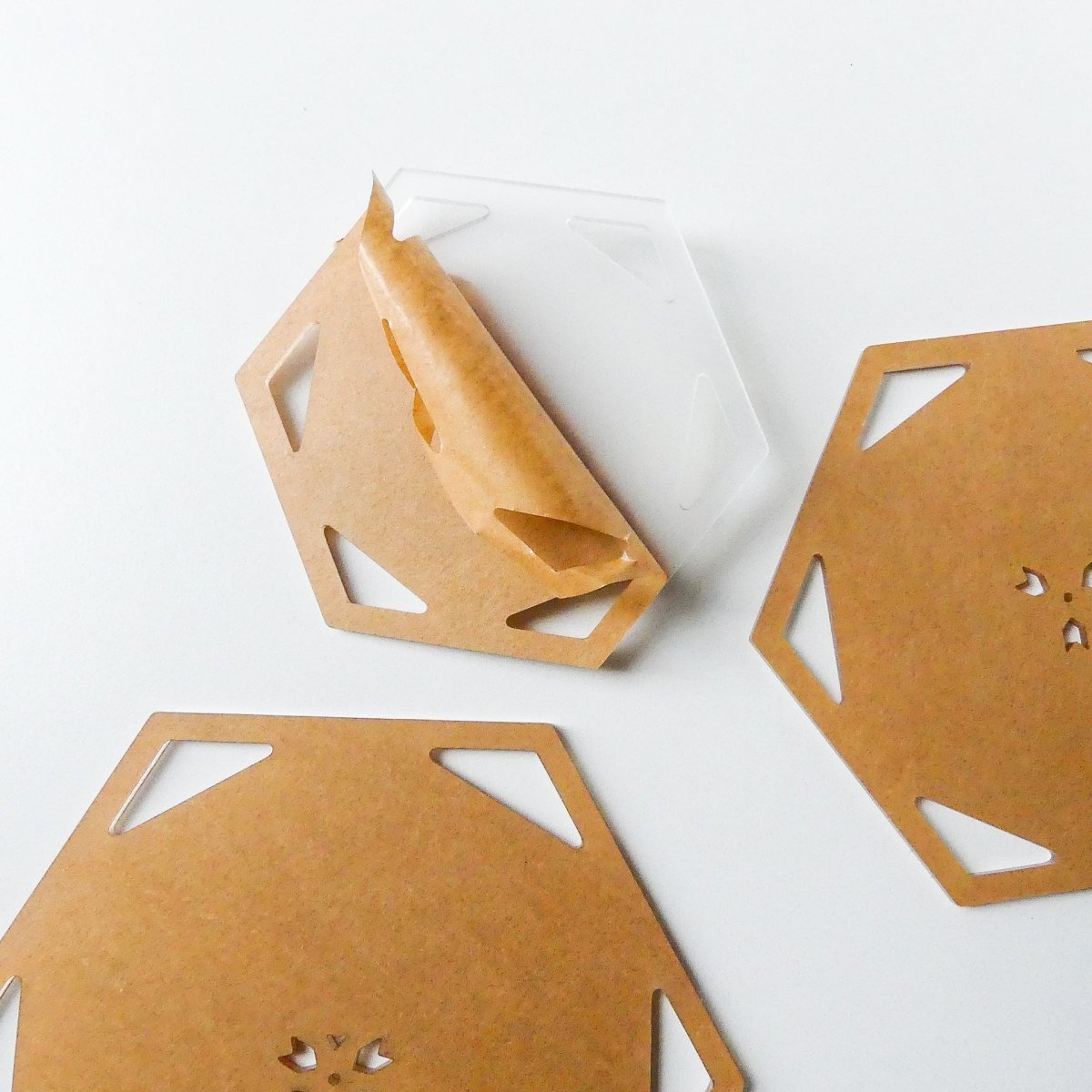 Protective paper on hexagon template set showing that it can be peeled off
