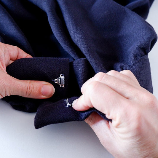 Hook & Eye closure attached to a pair of pants