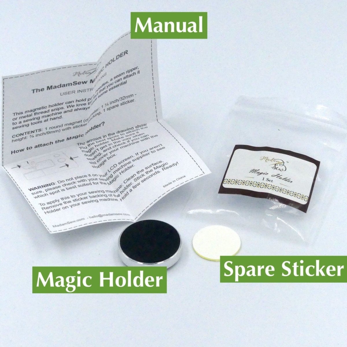 Magic Holder, packaging, instructions and spare sticker.