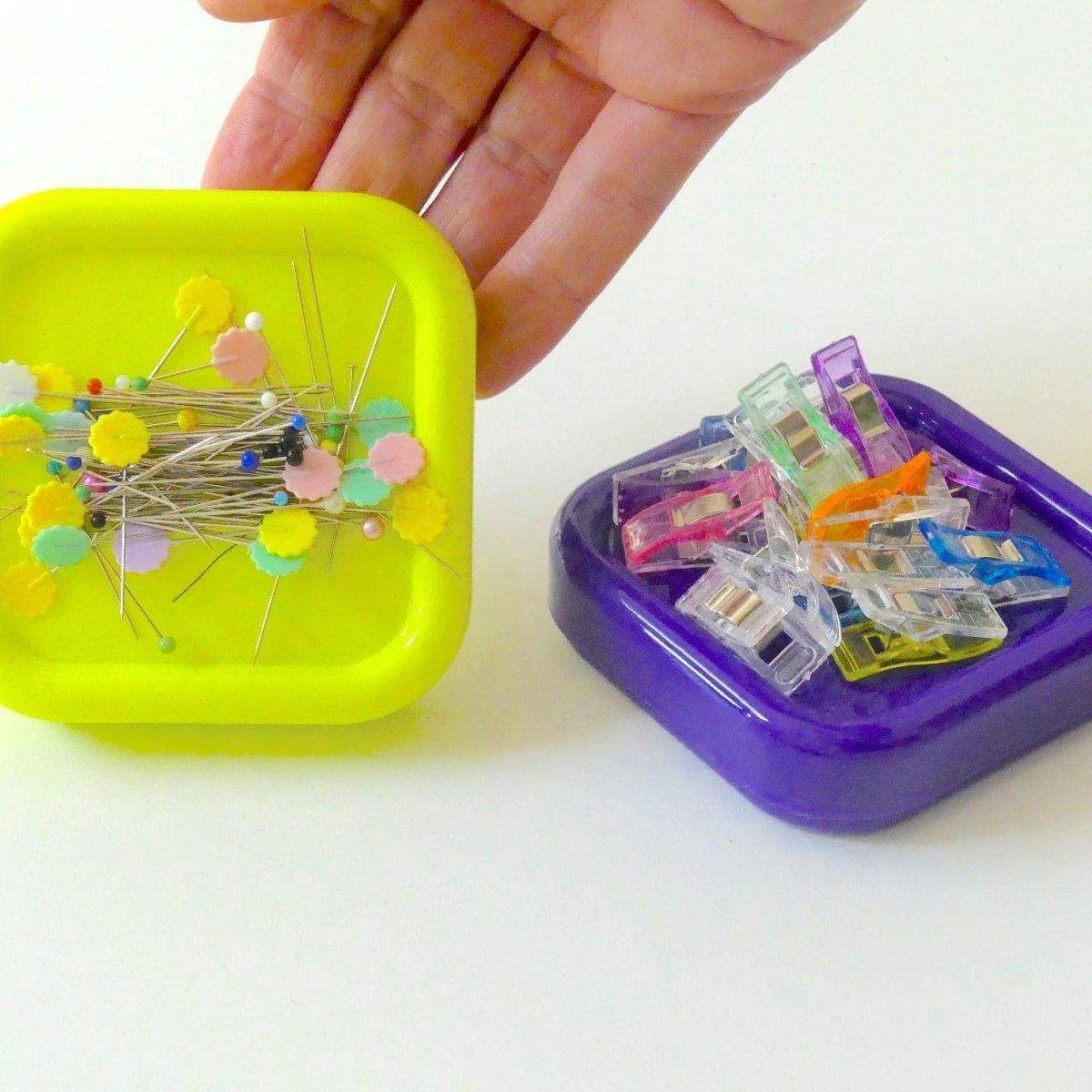 Magnetic Pin Cushions with pins and clips on them...both the Lime Green and Purple are shown.
