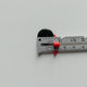 measuring a button with a measuring gauge with a slider