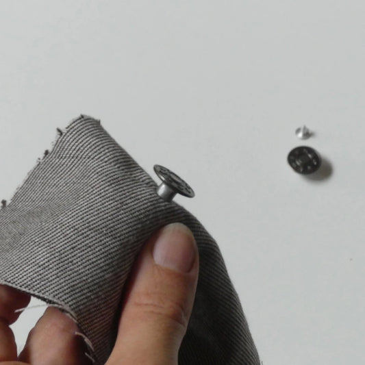 a jeans button stud on a fabric