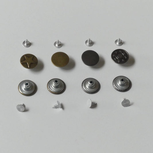 different parts of the metal snap button set in a row