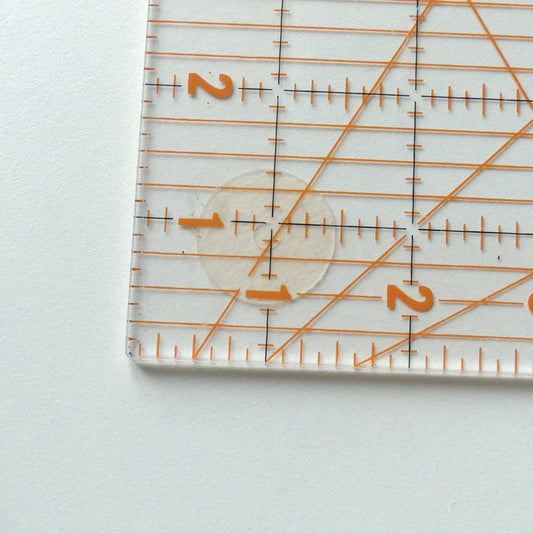 an adhesive anti-slip ring applied to a transparent quilt ruler to make it anti-slip