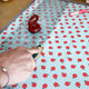 Quilting ruler with a ruler grip used to cut fabric with a rotary cutter
