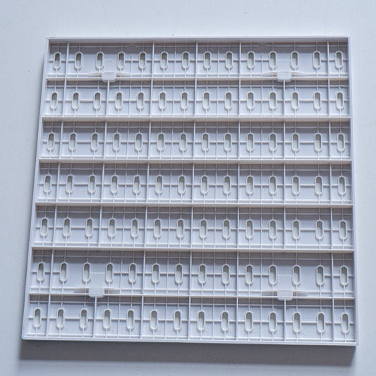 backside of a plastic Pegboard panel