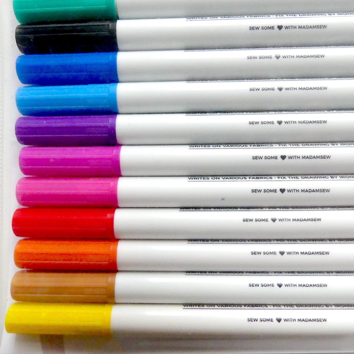 Ten colors of permanent fabric markers in a row