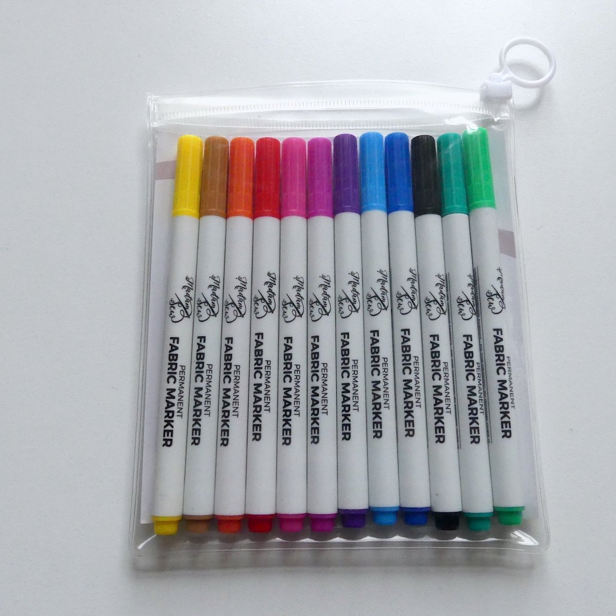 Ten colors of permanent fabric markers in a transparent pouch