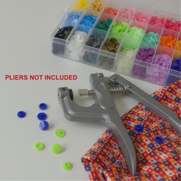 Box of Plastic Snap Buttons, pliers and fabric