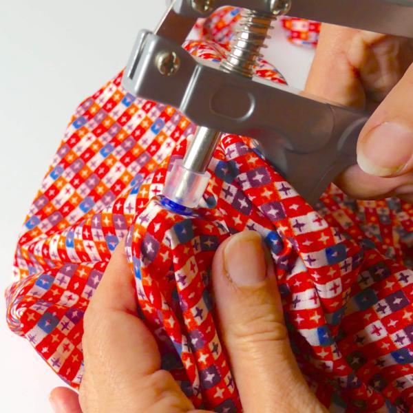 attach a size 20 snap with the metal pliers on a colorful grocery bag