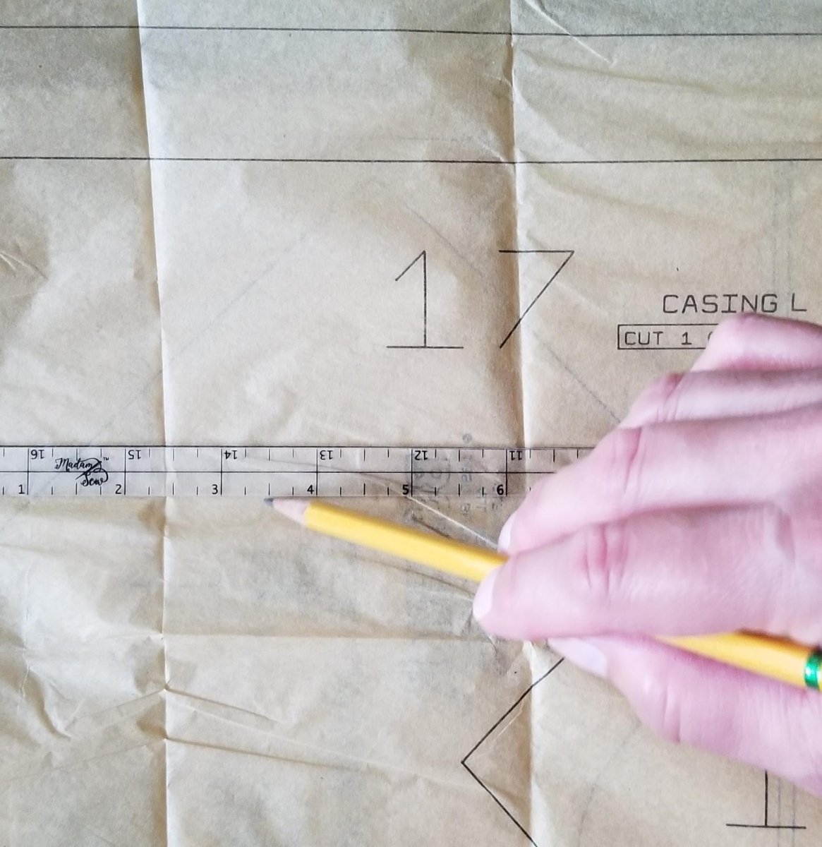Marking 1/2" line on a pattern piece using a Quarter Inch Patchwork Ruler "QIP"