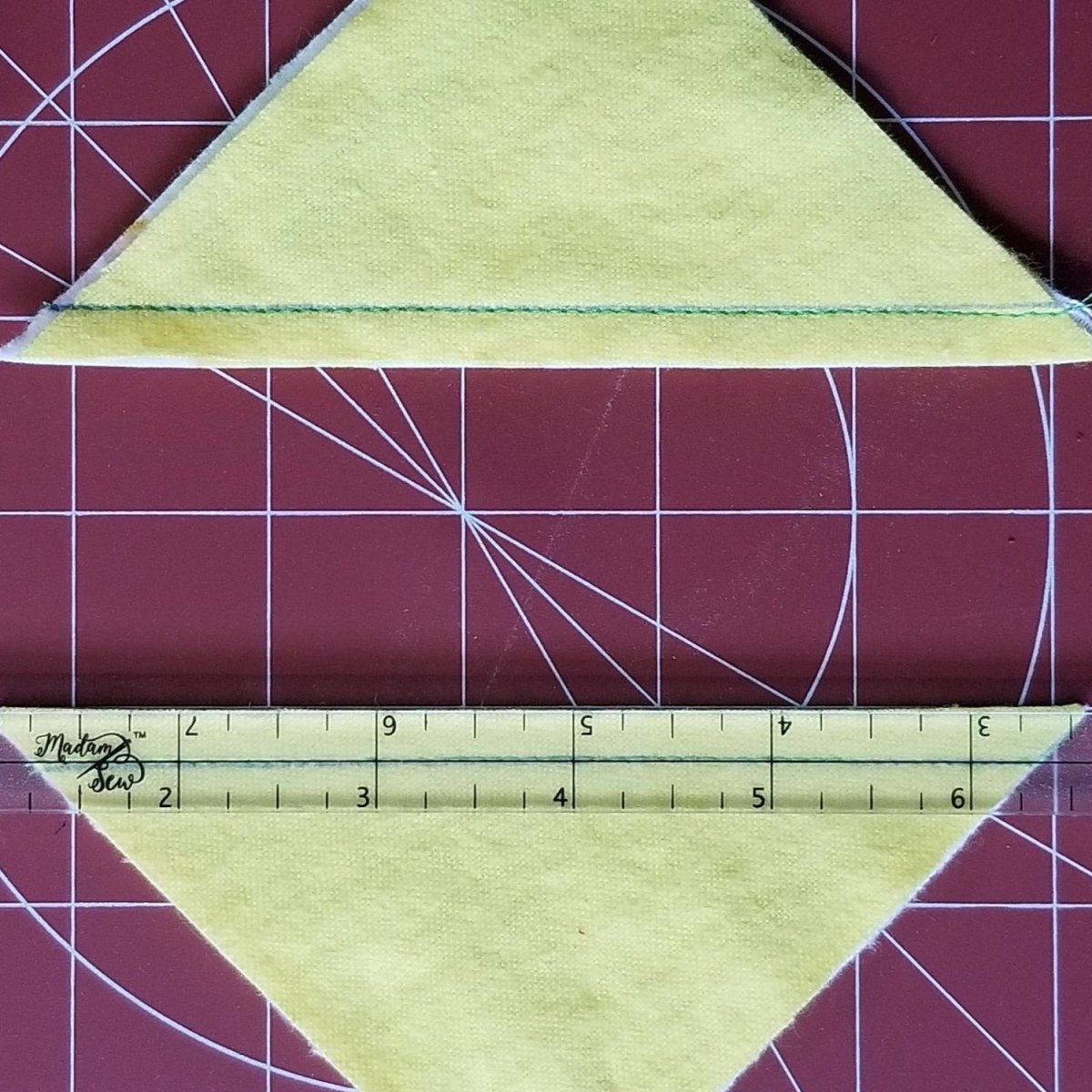Double checking 1/4" seam with a Quarter Inch Patchwork Ruler "QIP"