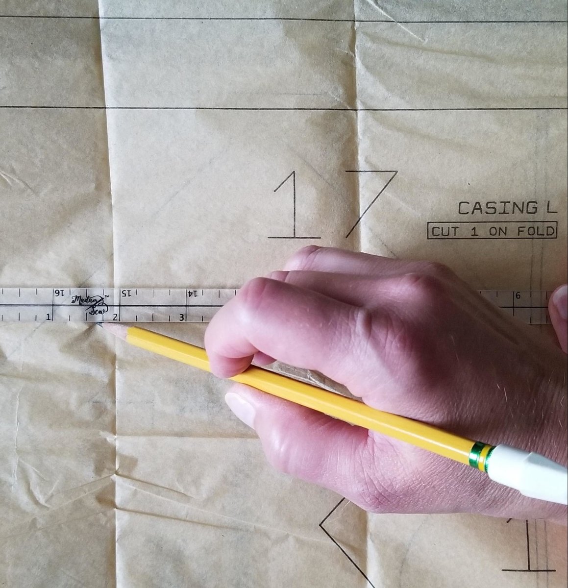 Marking 1/4" line on pattern using a Quarter Inch Patchwork Ruler "QIP"
