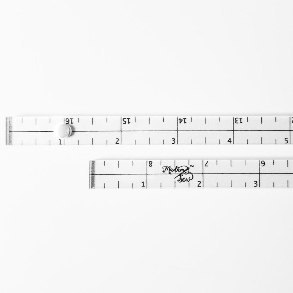 Close up of the Patchwork Rulers showing markings, center line and hole for hanging.