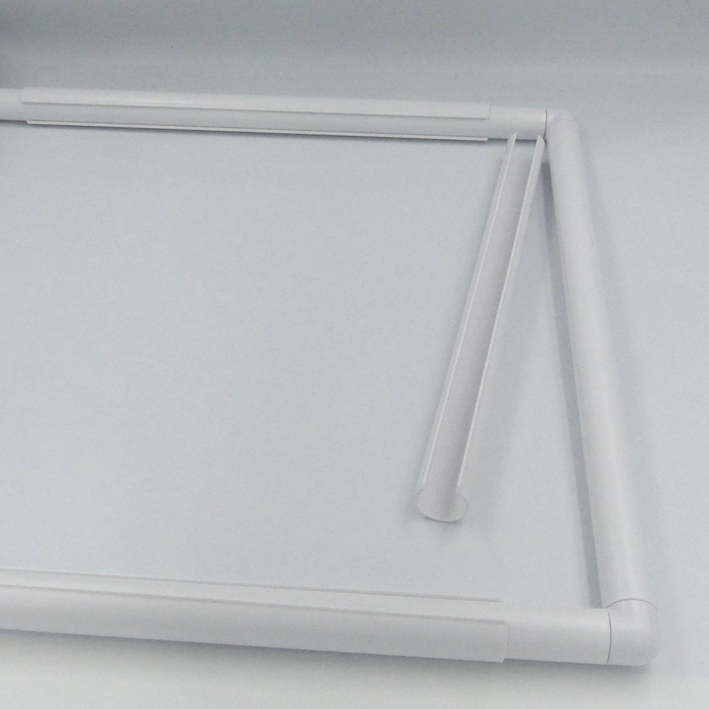 C-Shaped clamp next to a Quilt Frame.