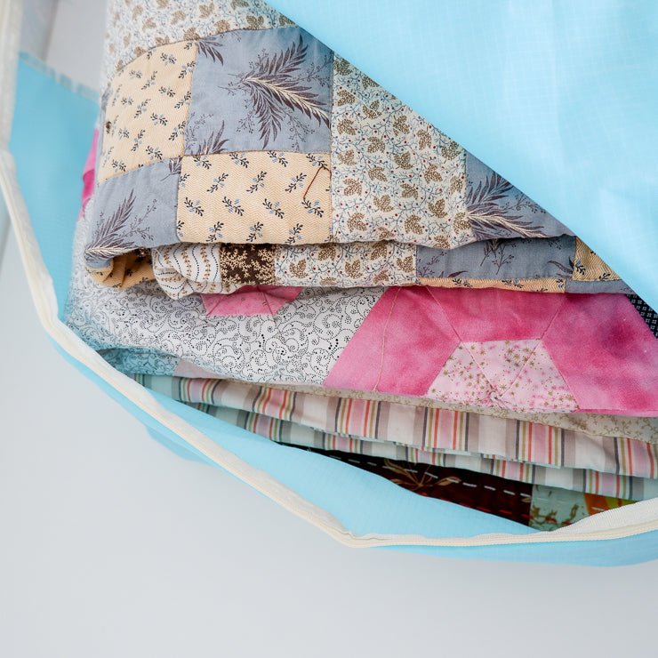 Quilts in a quilt storage bag