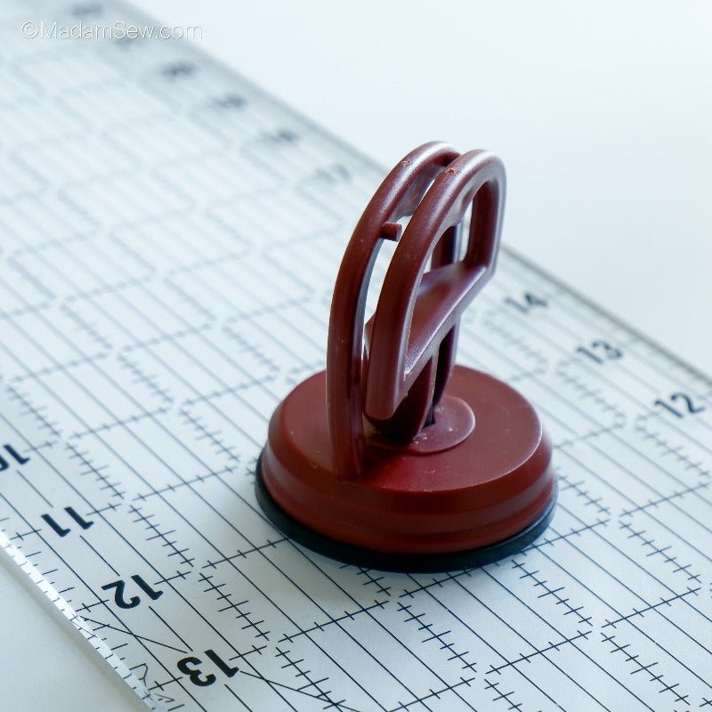 Ruler handle on a quilt ruler - suction cup mechanism