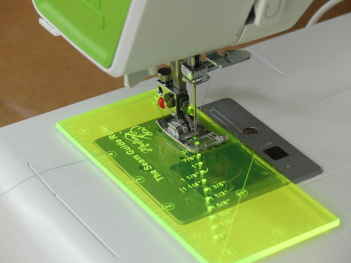 a gif showing how to use the seam guide ruler with a magnetic seam guide on a sewing machine