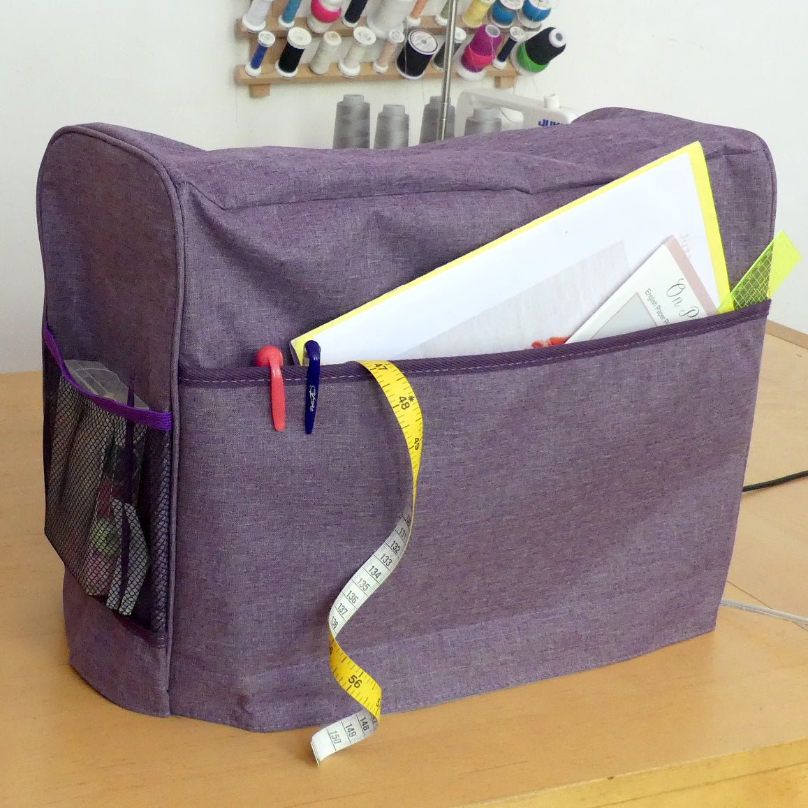 Purple Sewing Machine Cover with extra pockets to store tools or patterns