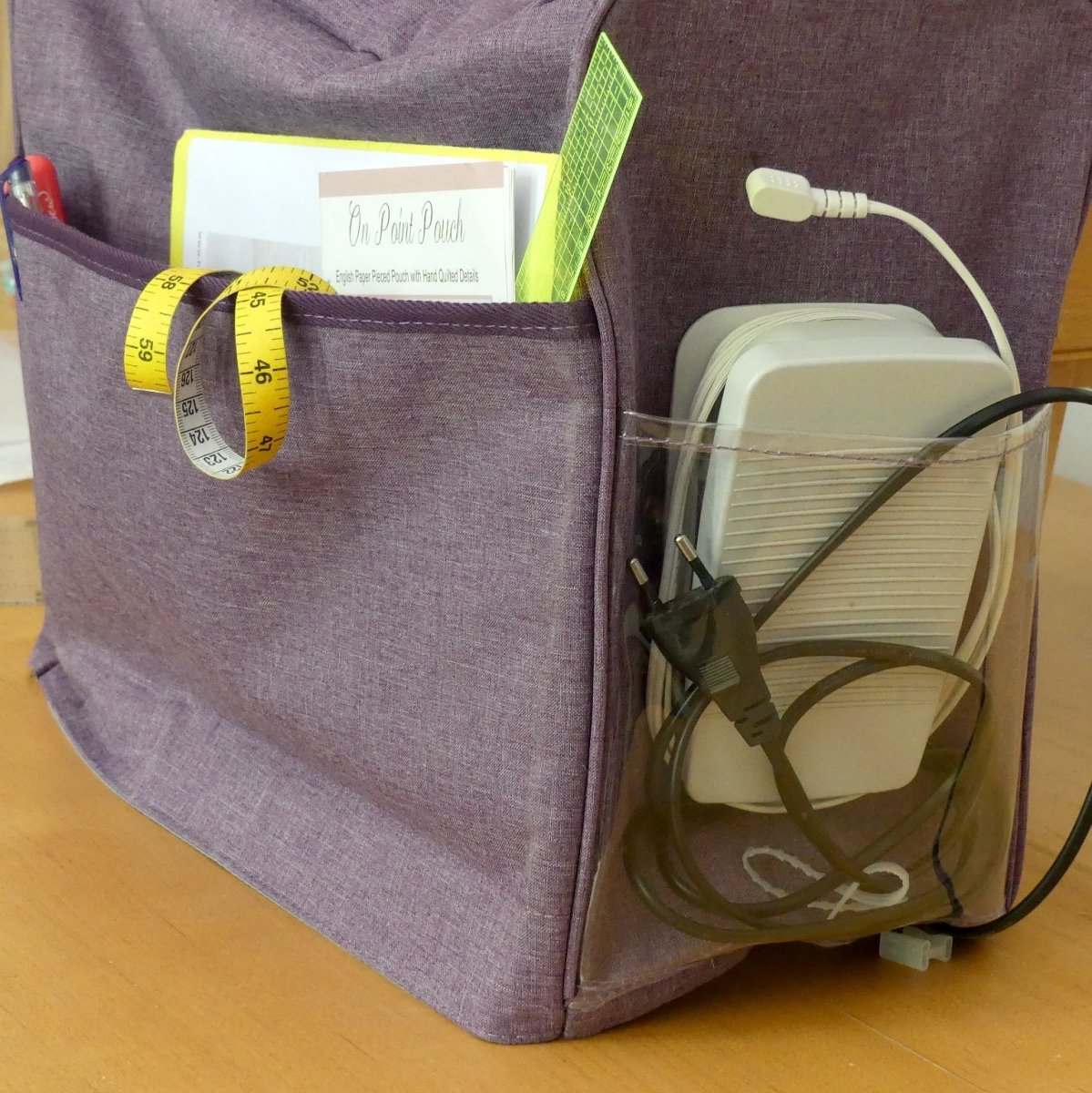 Purple Sewing Machine Cover with extra pockets to store the sewing machine pedal