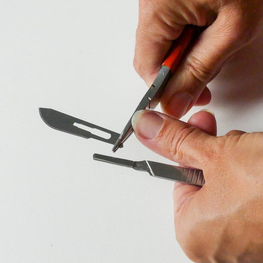 Attaching a spare blad on the thread knife of the bird nest toolkit