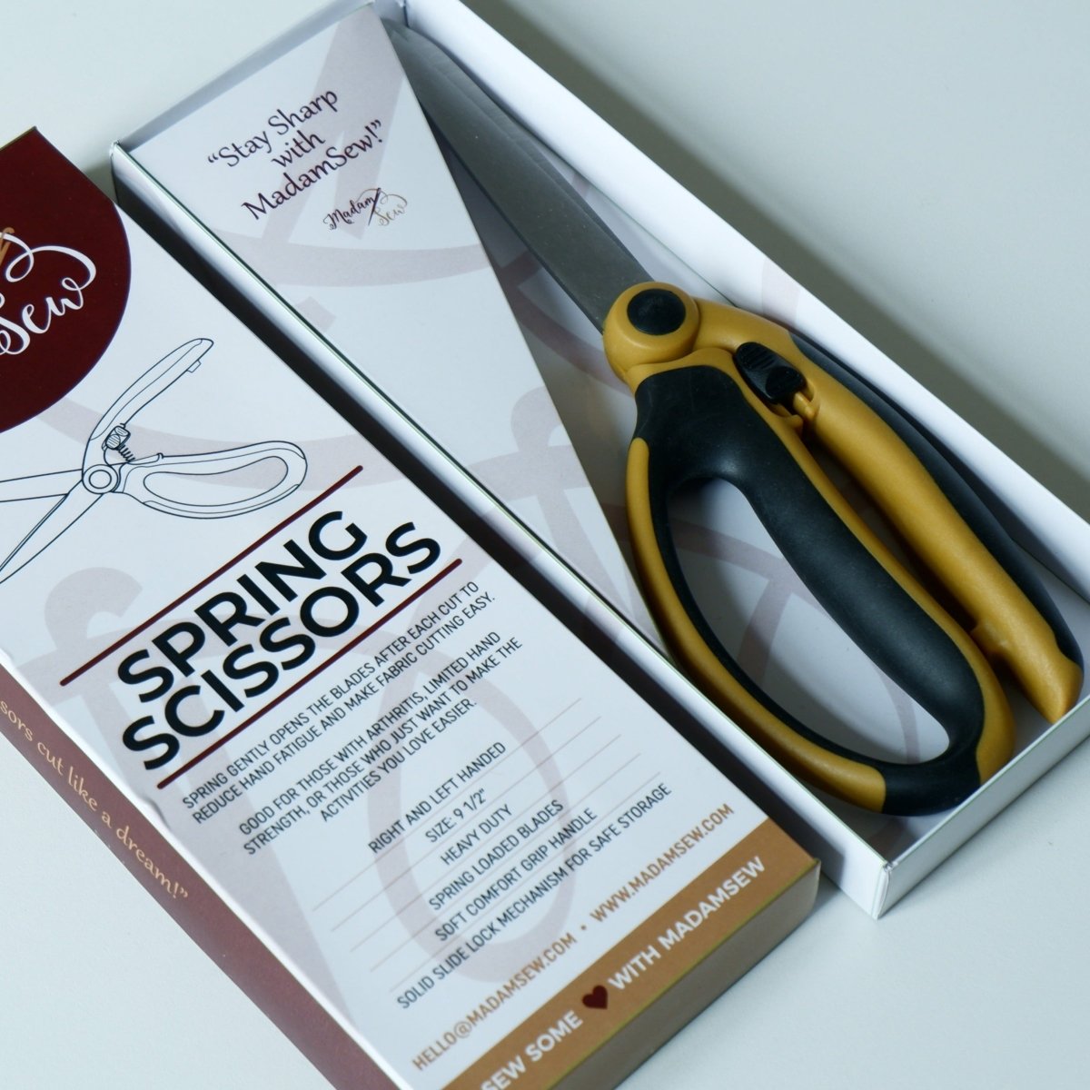 The Madam Sew spring scissors in an open box