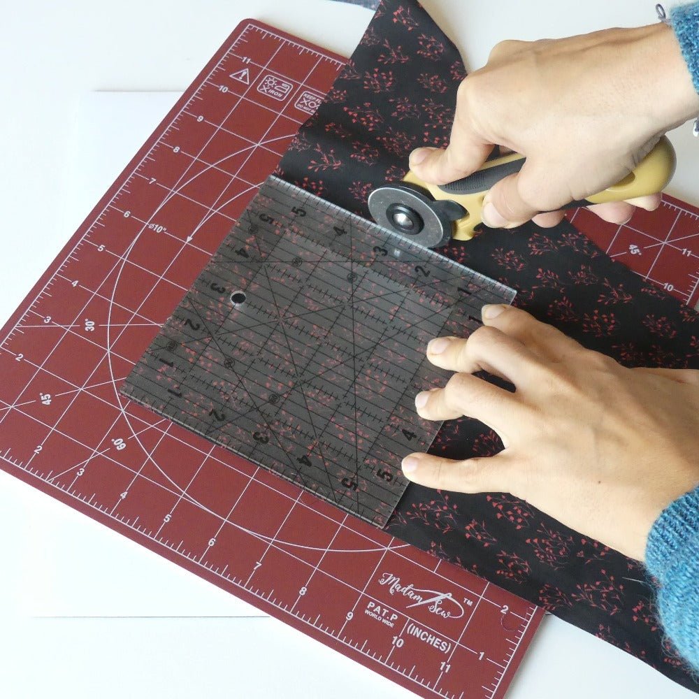 Square Non-Slip Quilting Ruler on a piece of fabric