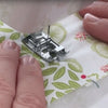 sewing on a seam with a stitch in the ditch foot