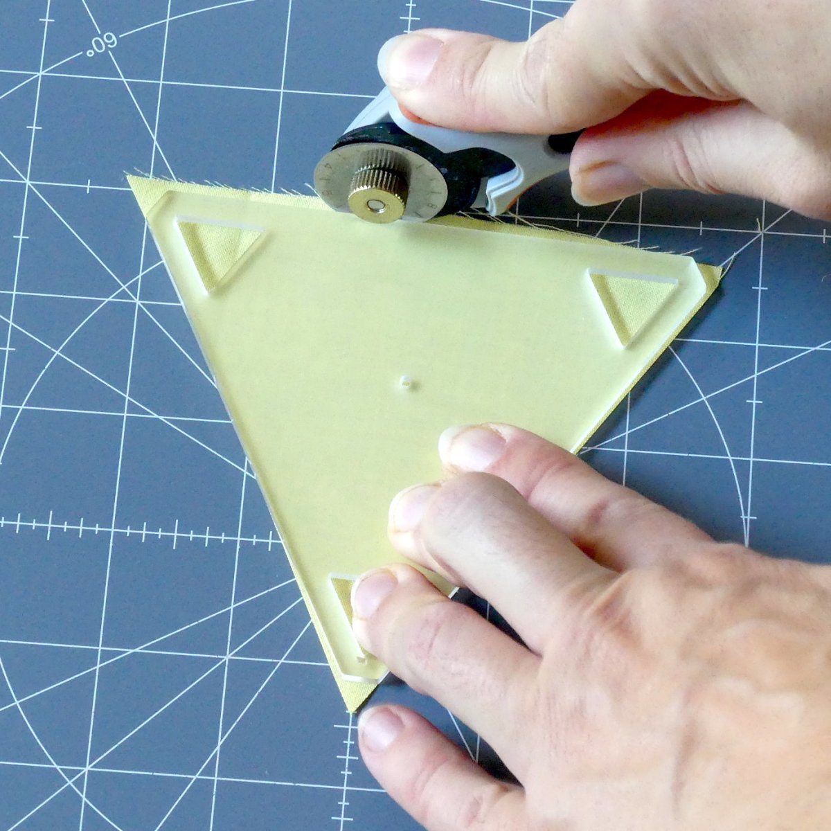 Cutting around a triangle template