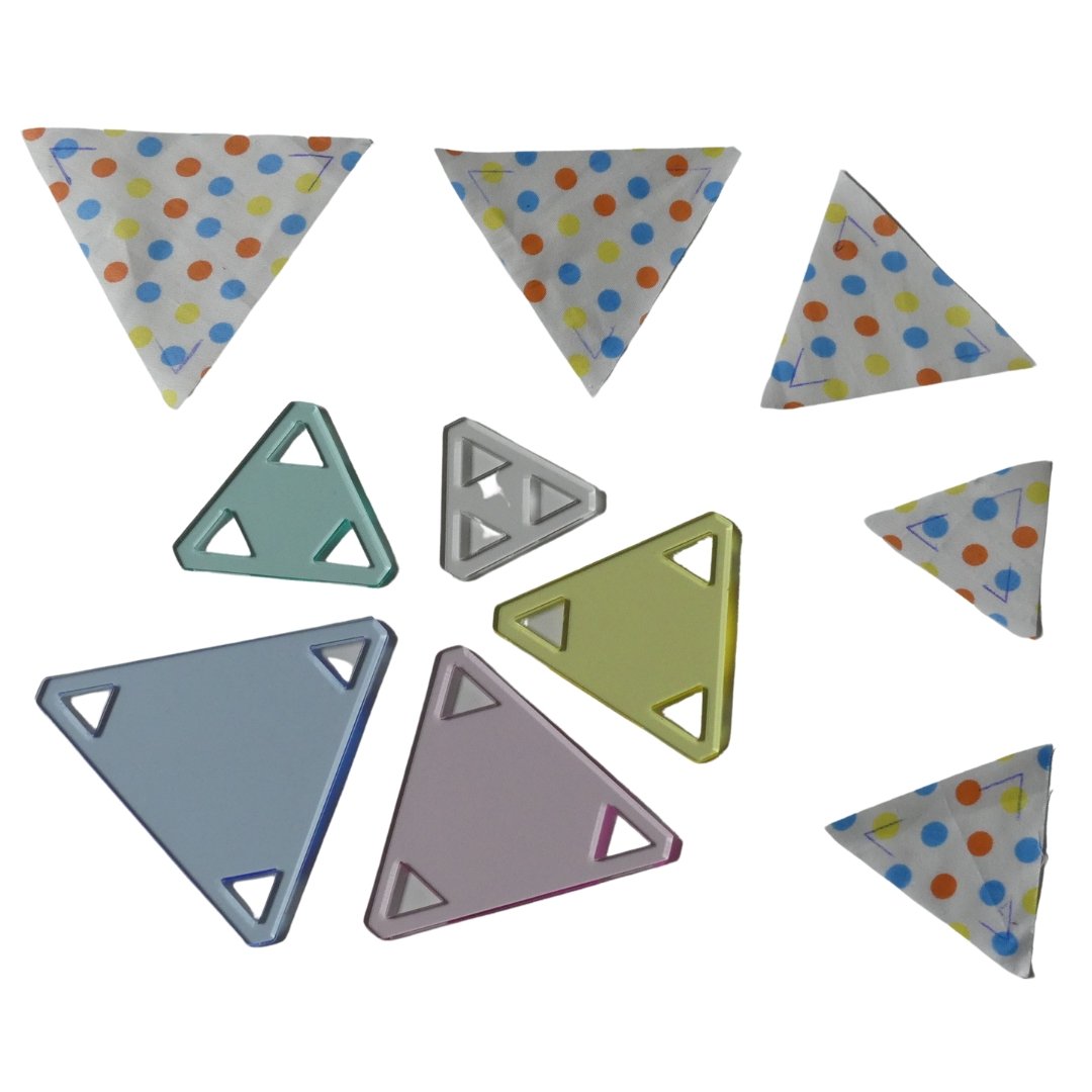 Fabric shapes cut using the 5pc Colorful, 60 degree Triangle Template Set