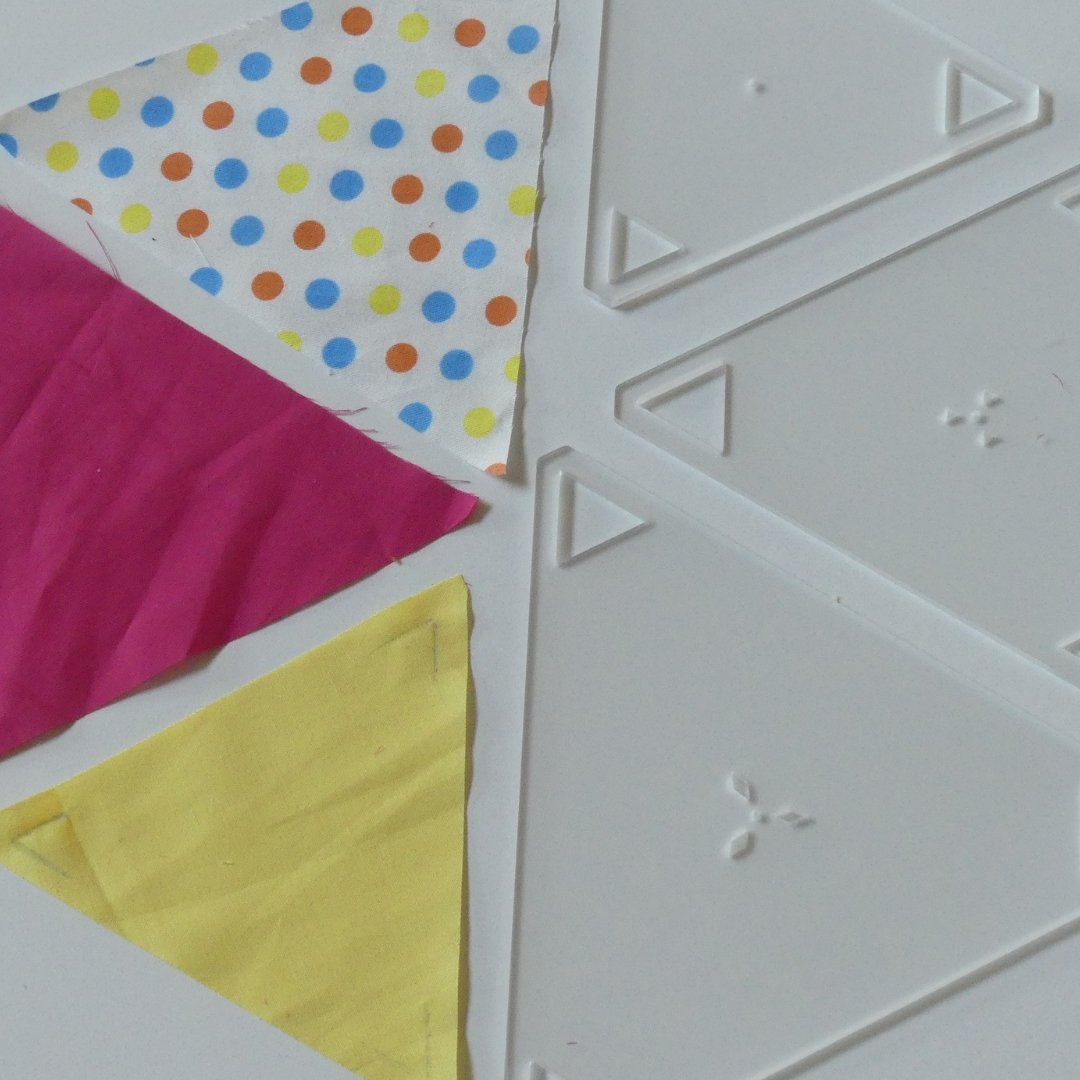 Fabric triangles cut using the 60 degree 3pc Triangle Template Set