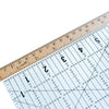 a quilt ruler and vintage craft tape aligned