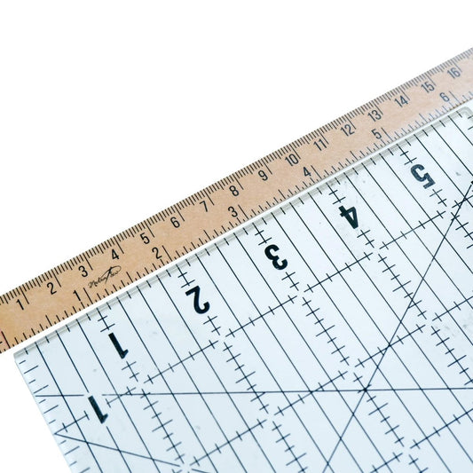 a quilt ruler and vintage craft tape aligned