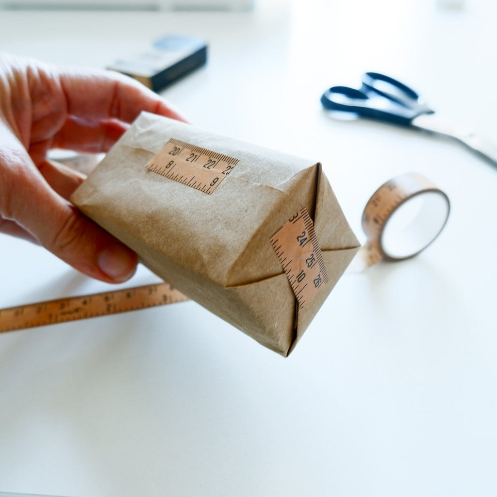 MadamSew Vintage Ruler Craft tape being shown used for taping a gift