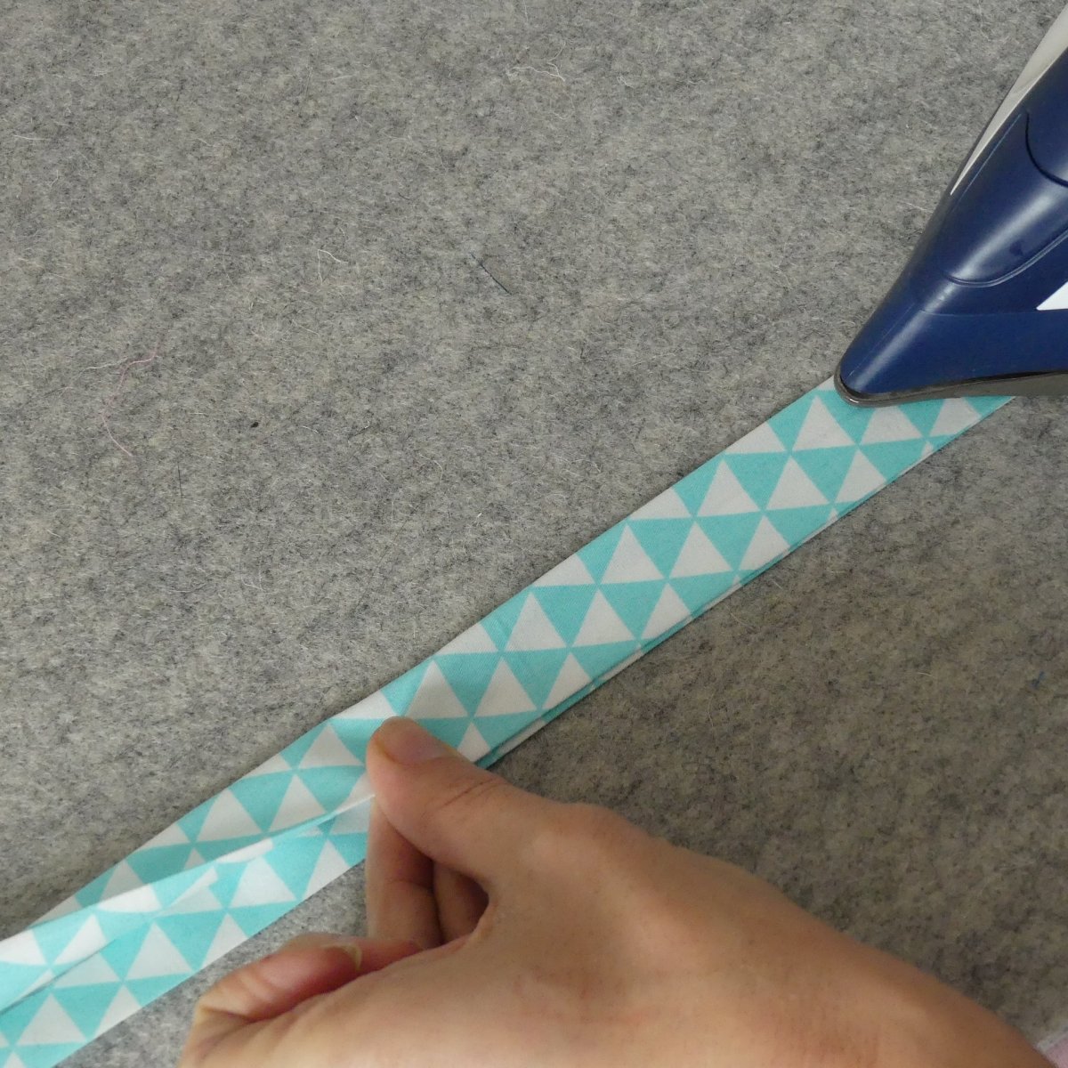 Ironing double folded bias tape that had been made using the Extra Larger (XL) Bias Tape Maker